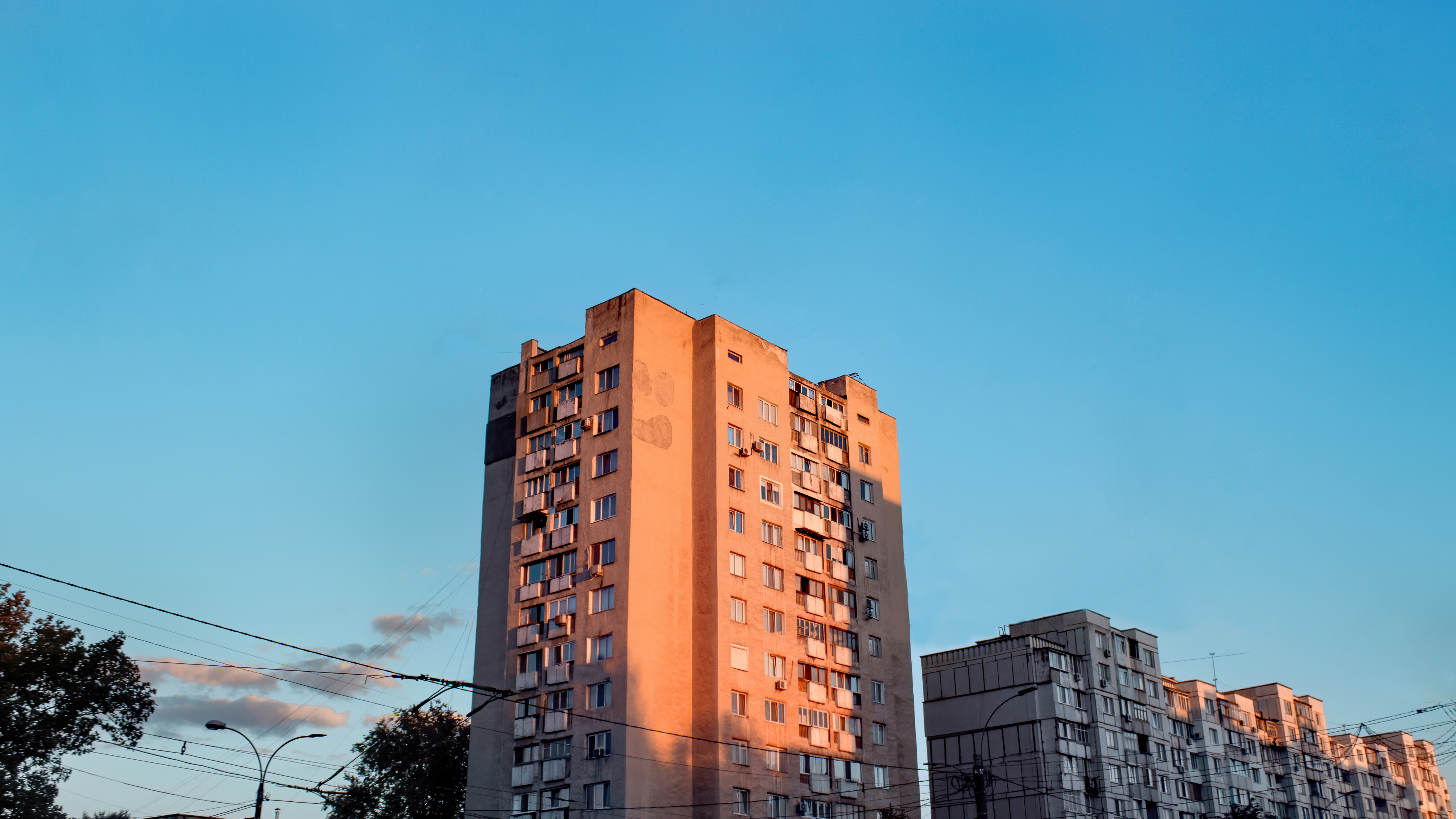 aged-apartment-houses-sunset-with-blue-sky.jpg