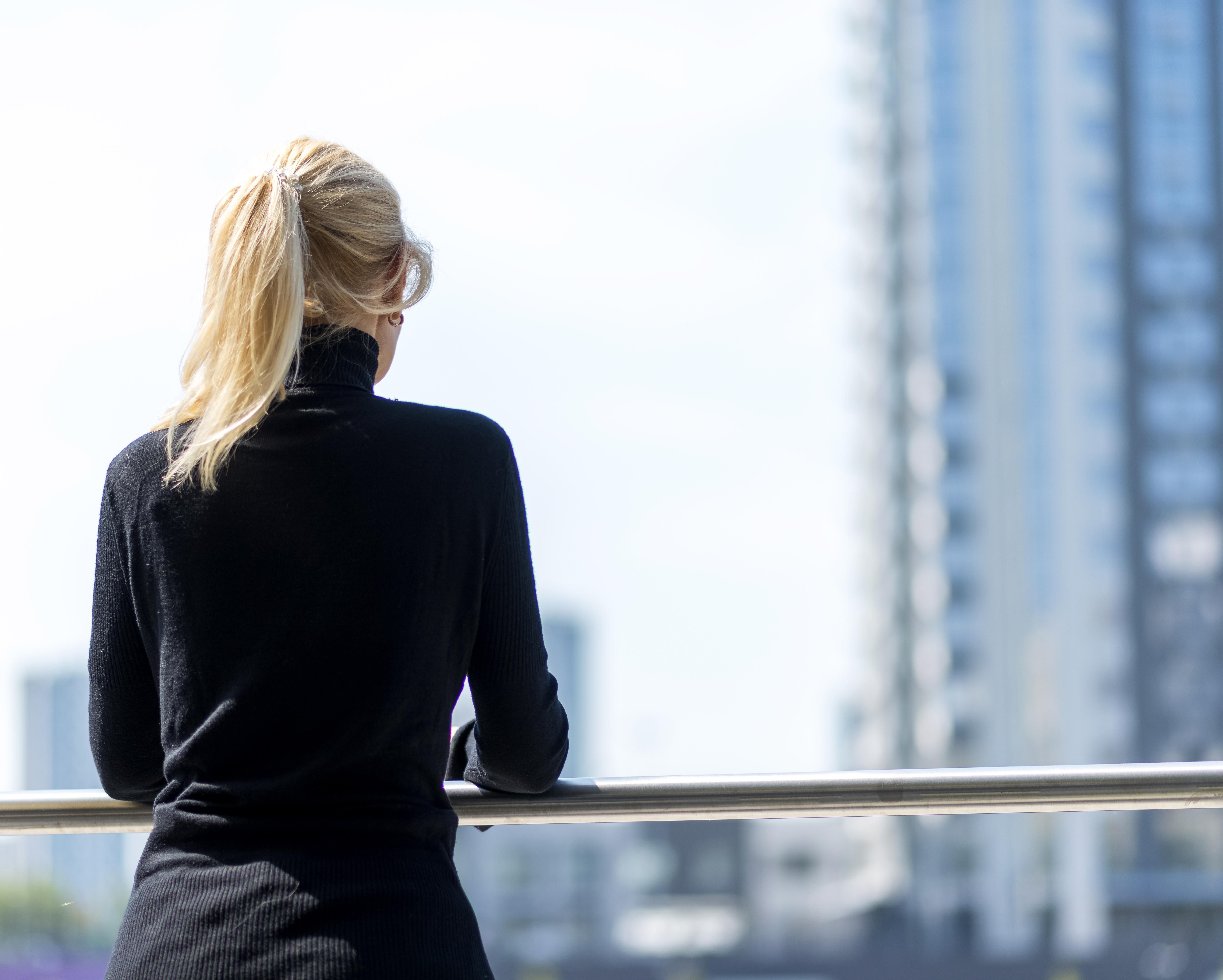 back-view-older-business-woman-admiring-view-outdoors.jpg