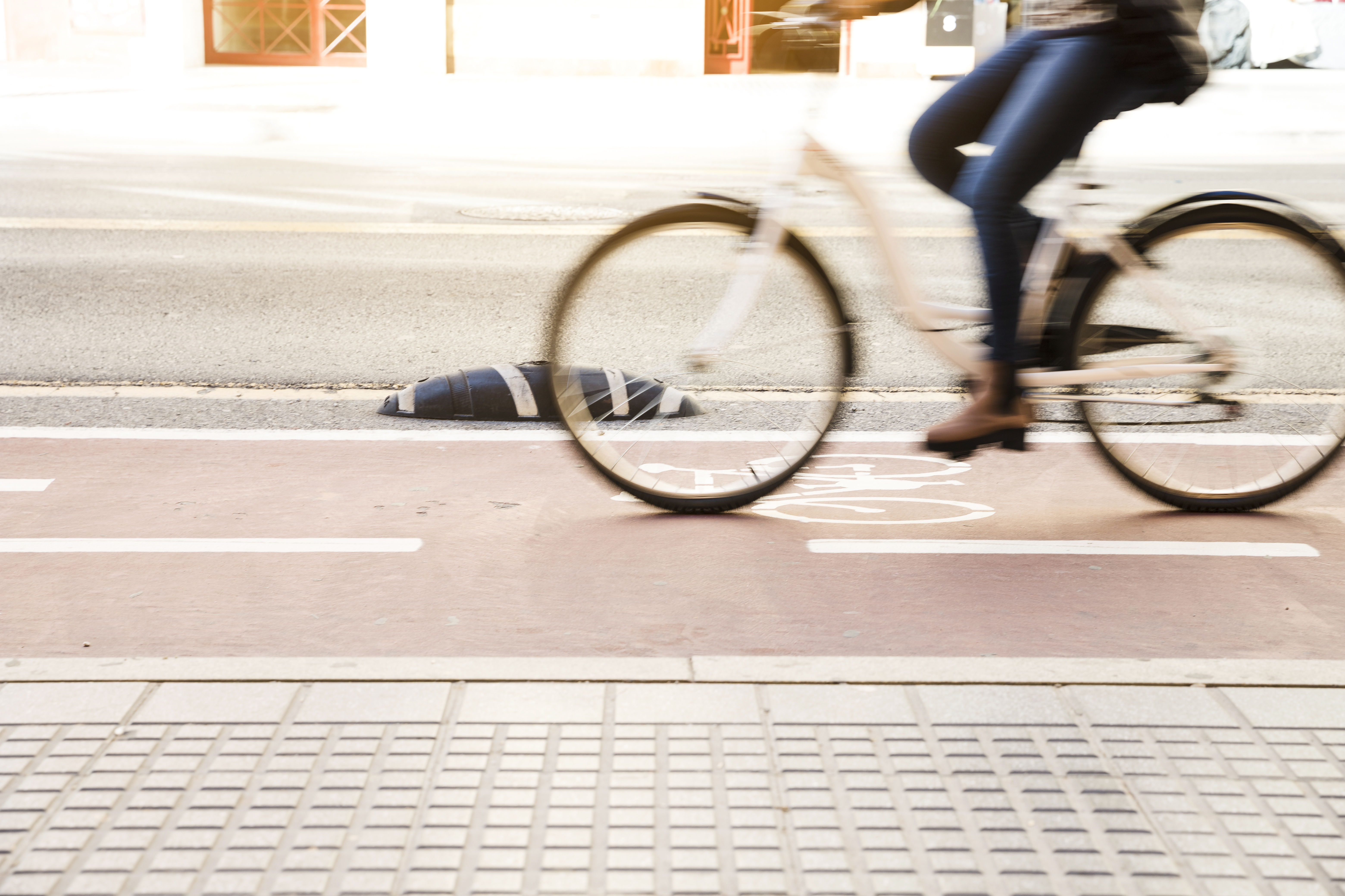 close-up-woman-riding-bike-cycle-lane.jpg
