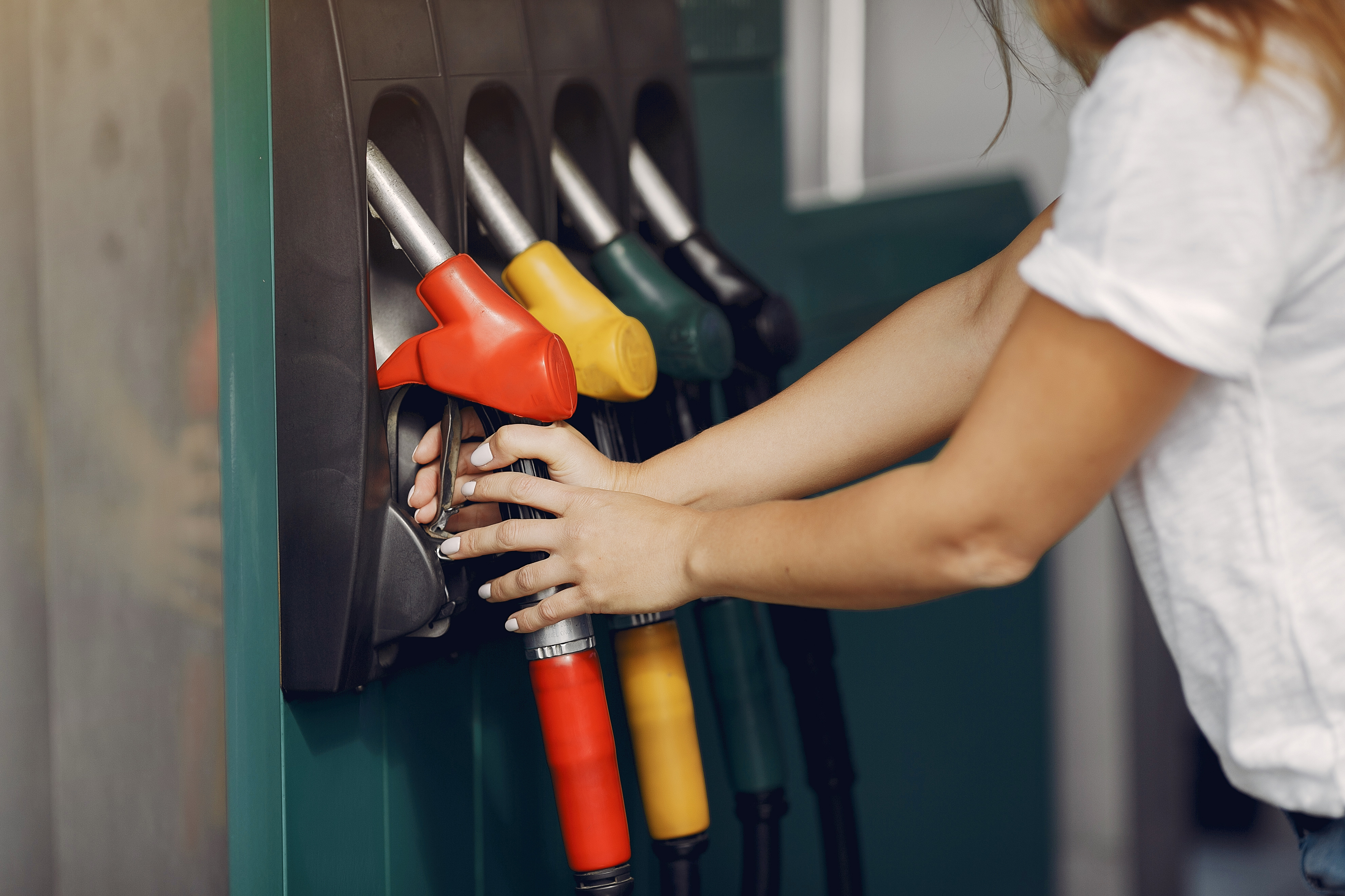 elegant-woman-standing-gas-station.jpg