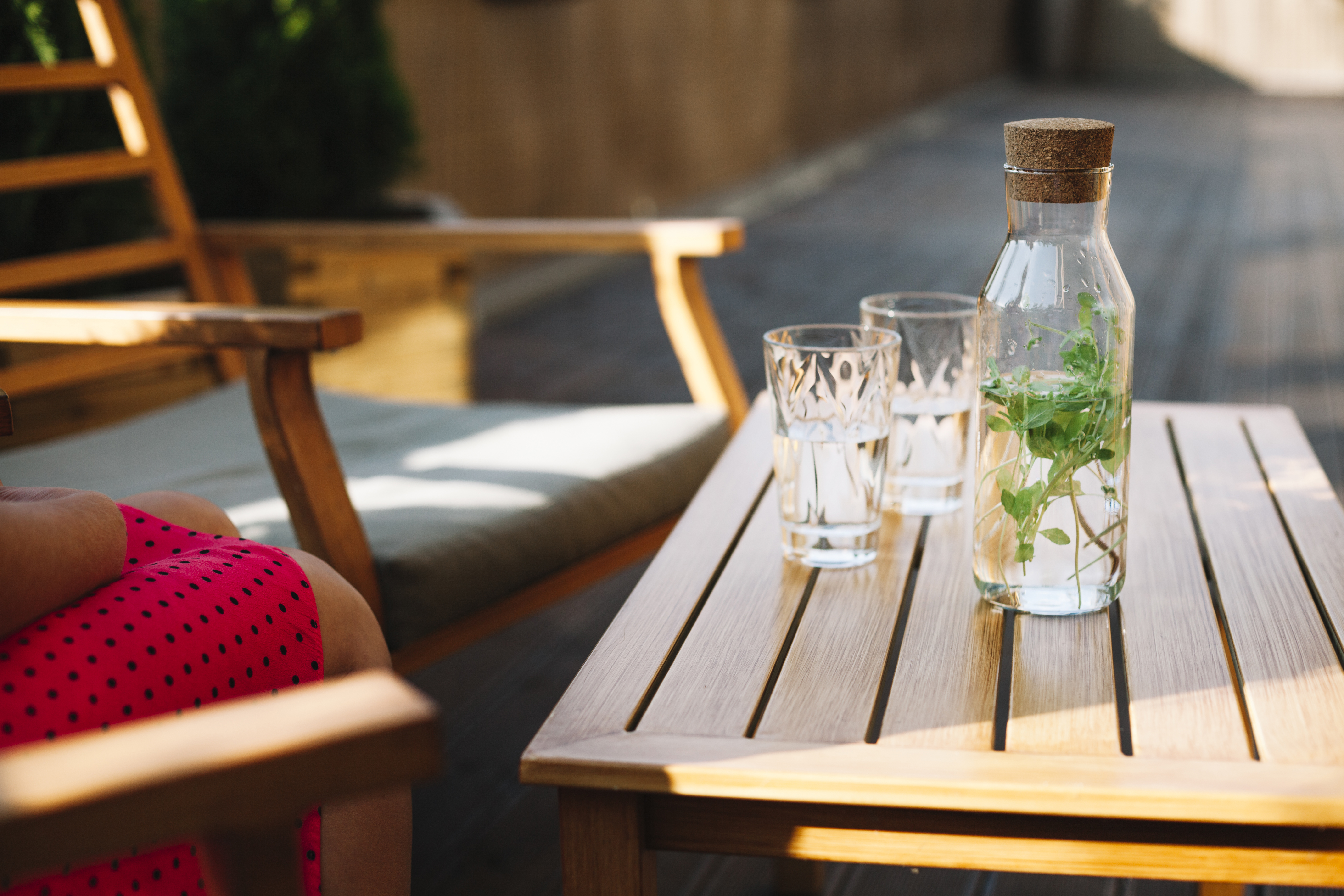 herbal-drink-bottle-with-two-glasses-wooden-table.jpg