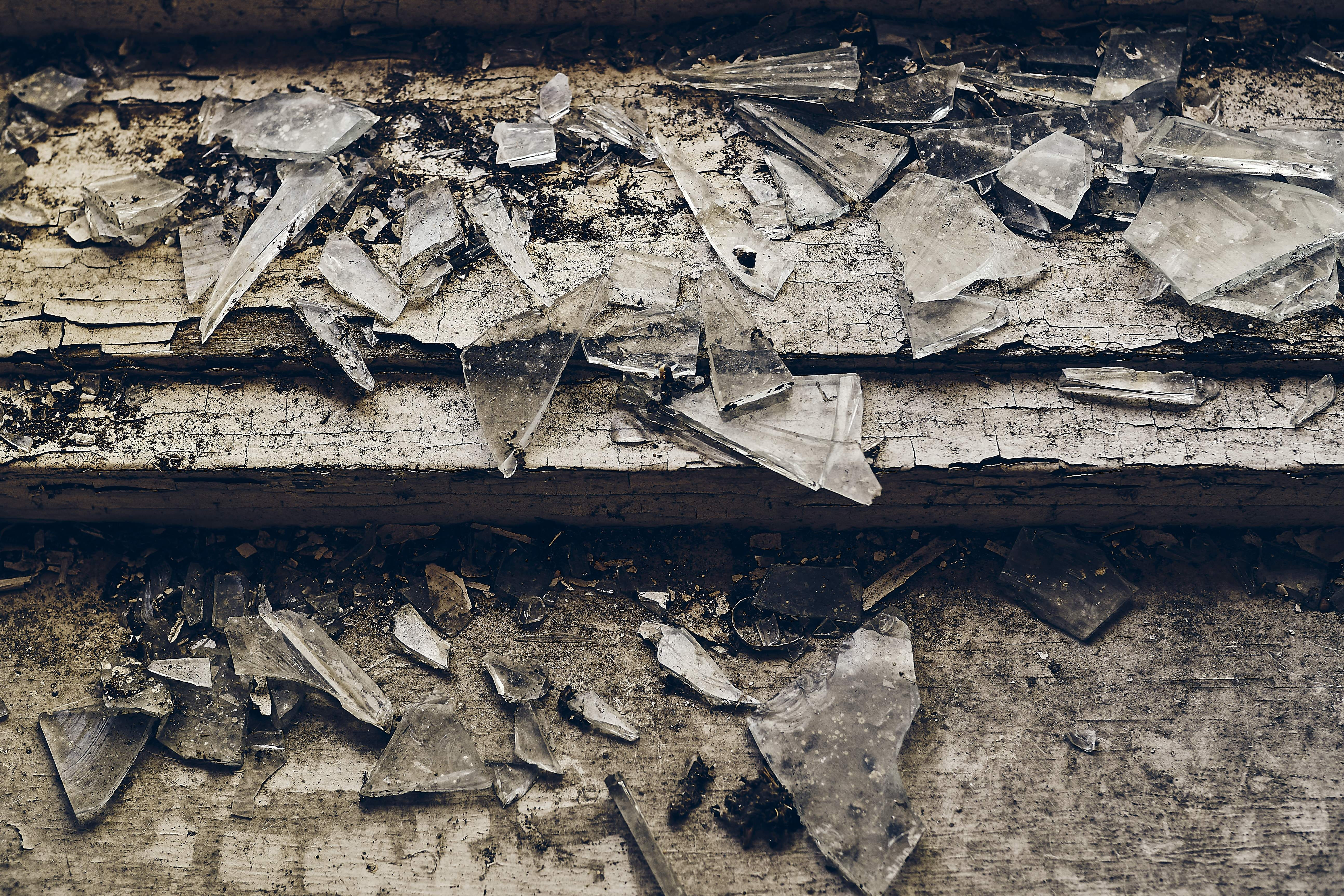 high-angle-shot-shattered-glass-scattered-old-wooden-stair-2.jpg