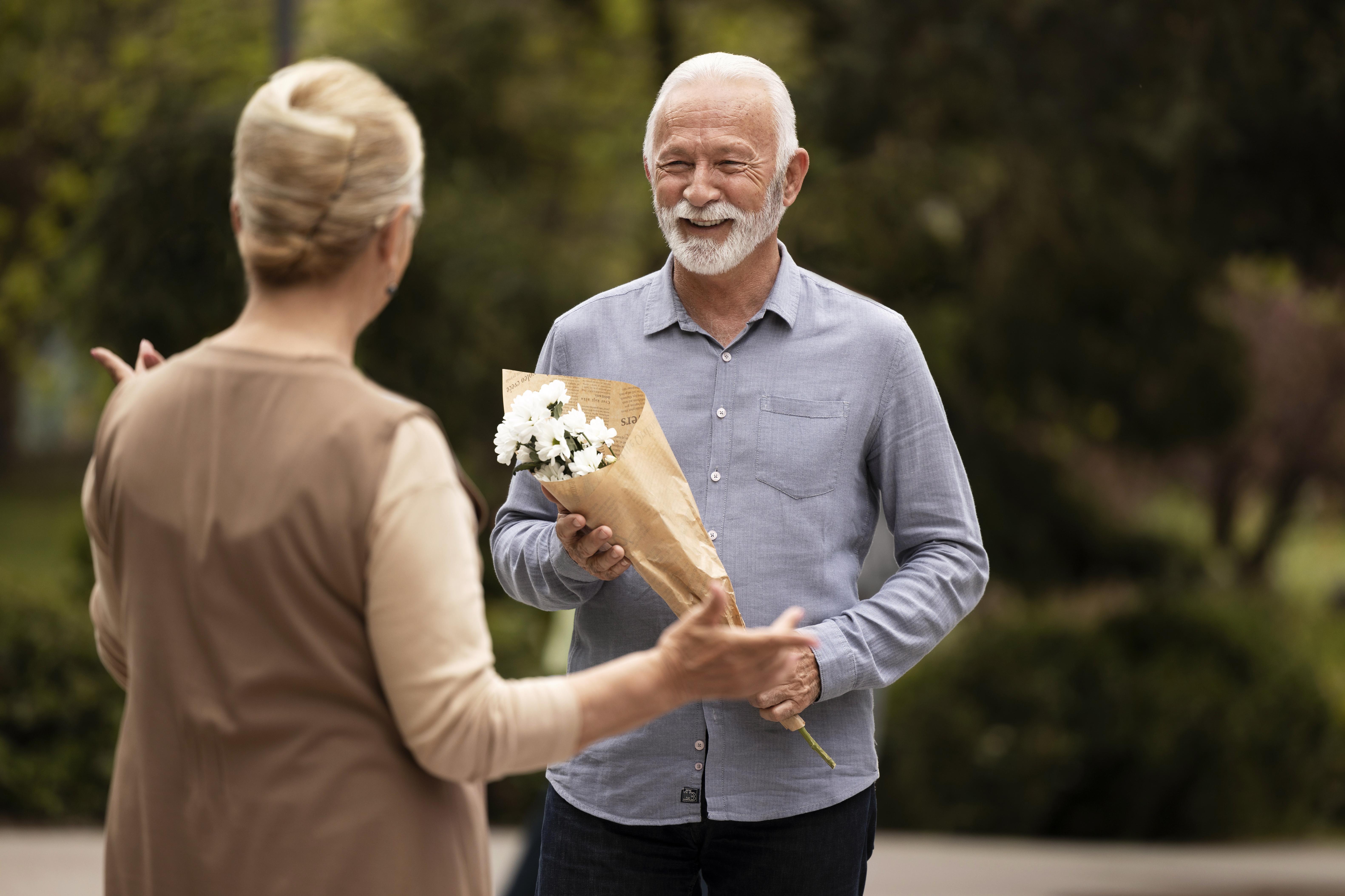 medium-shot-man-offering-flowers.jpg