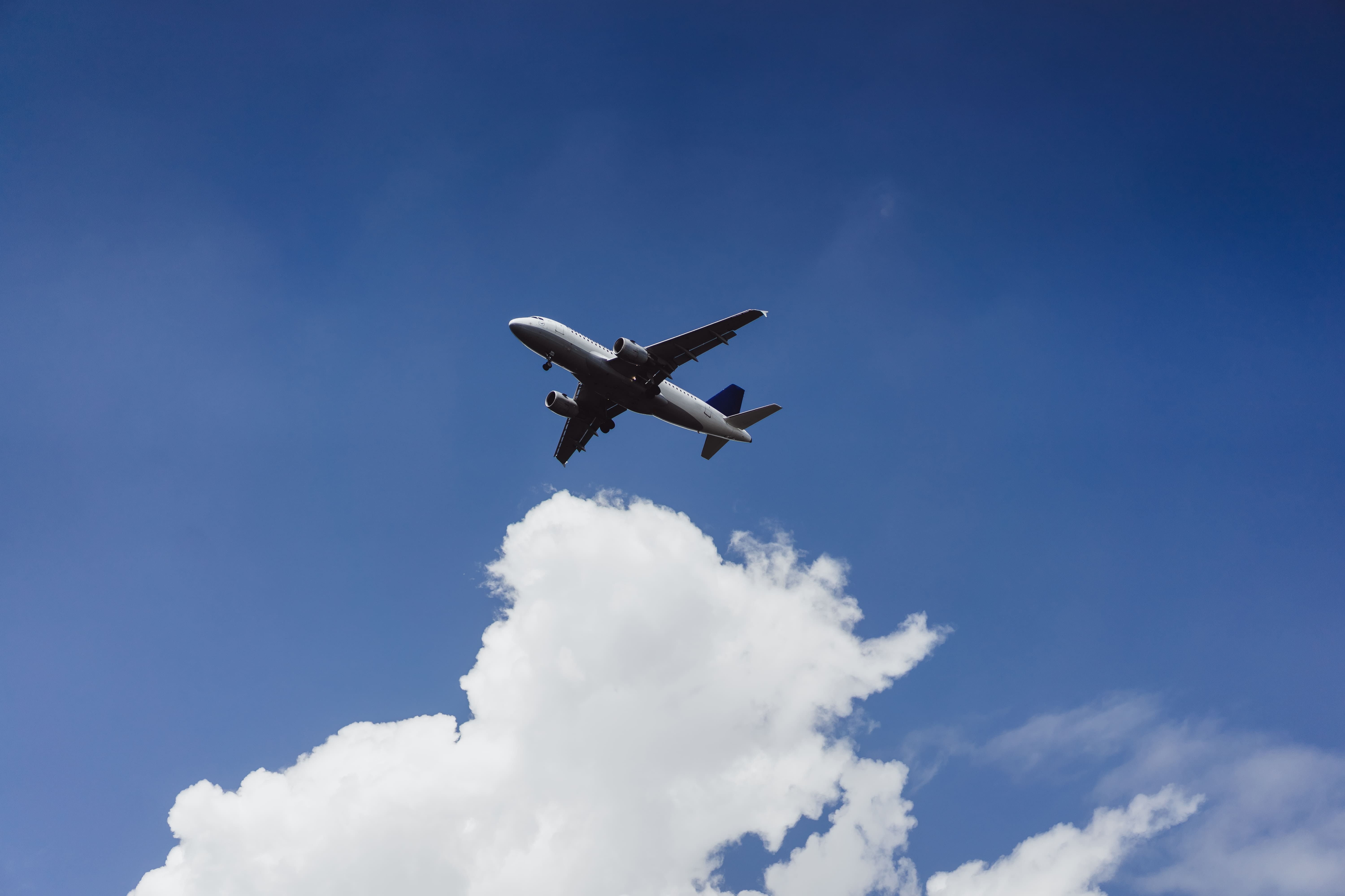 plane-is-flying-blue-sky-2.jpg