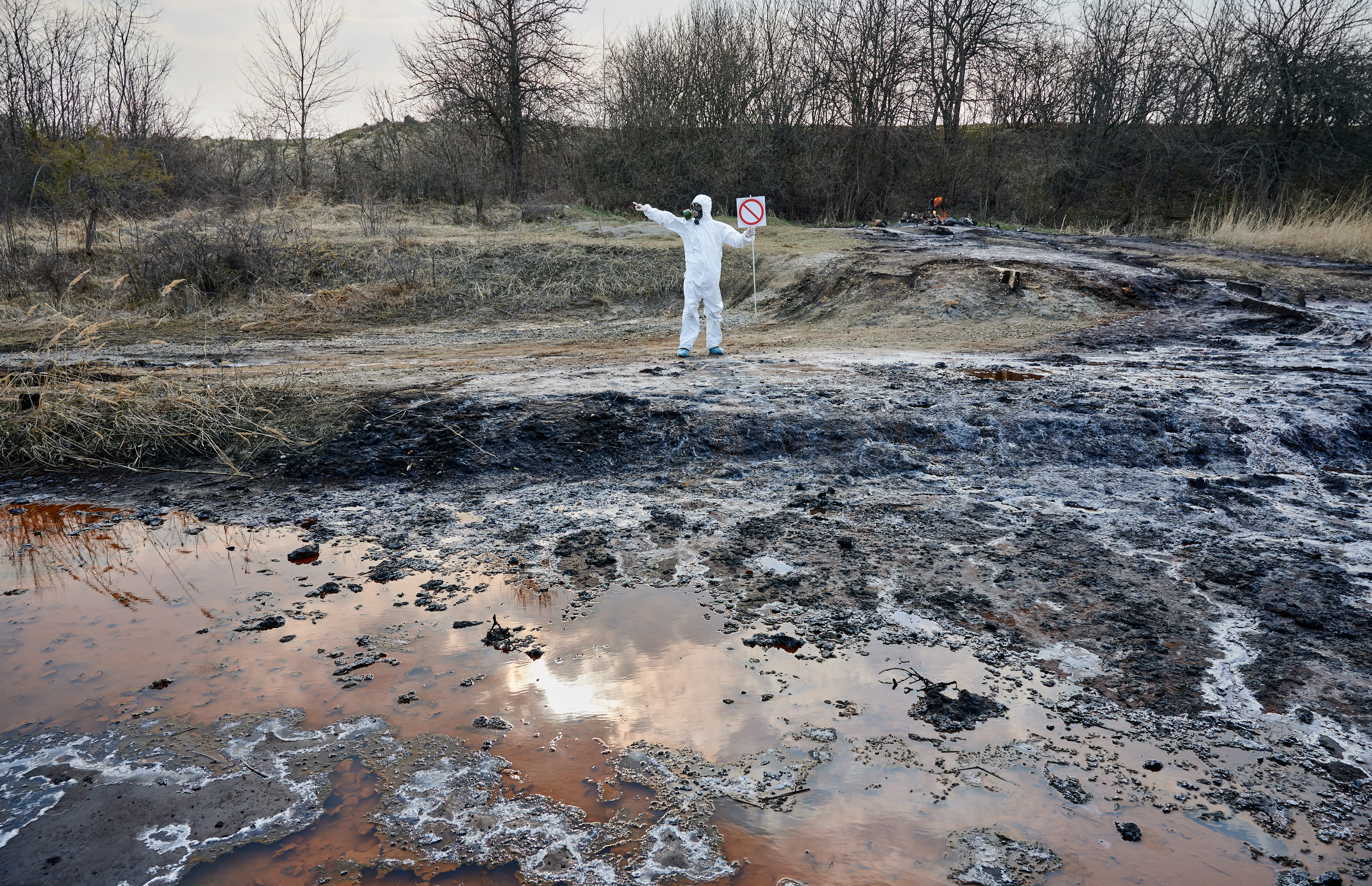 scientist-exploring-territory-emission-area-polluted-water-man-protective-suit-2.jpg