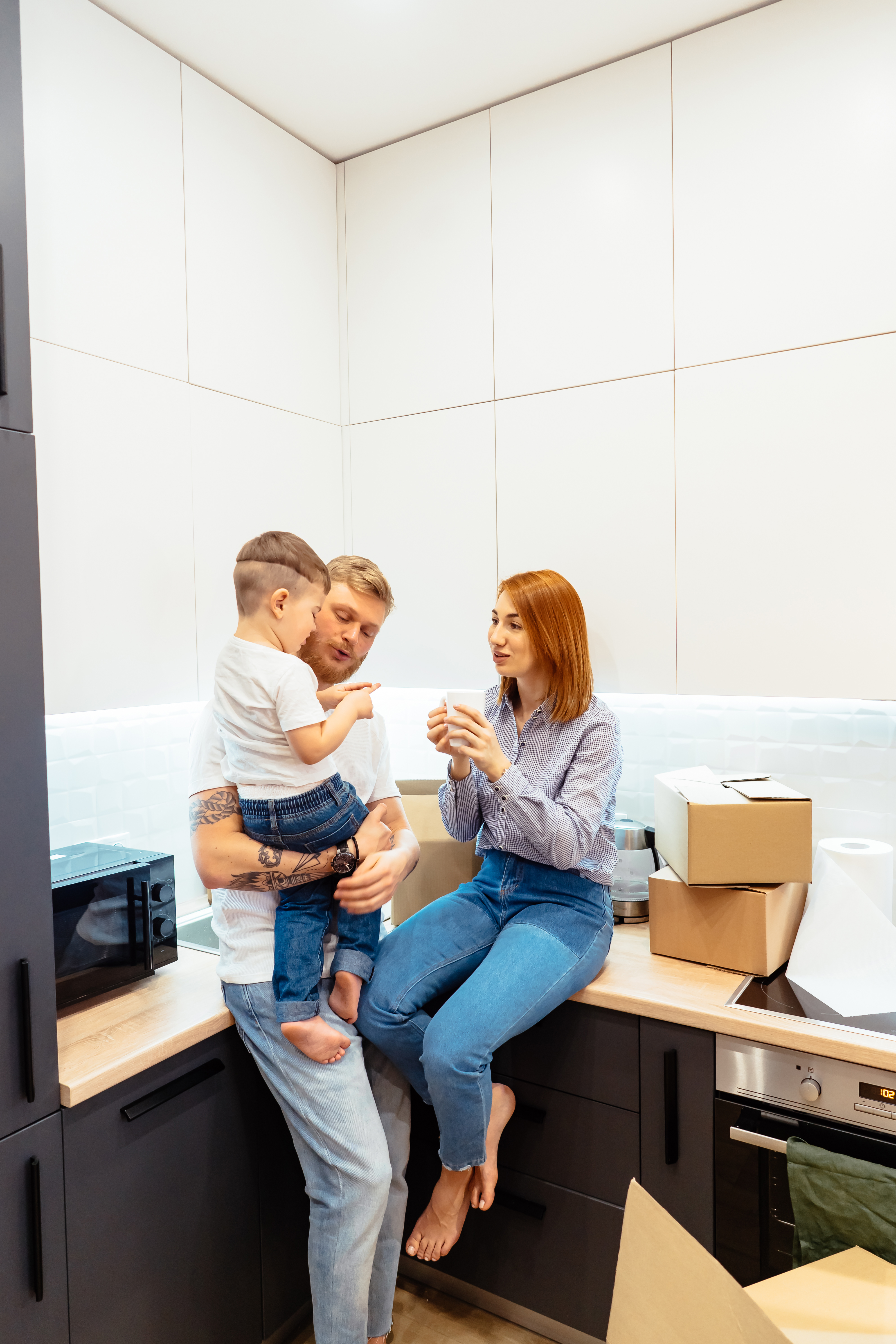 young-family-unpacking-boxes-new-home.jpg